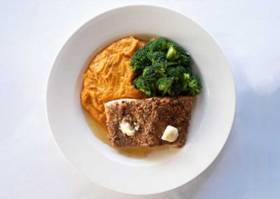 Crusted salmon dinner with broccolli and squash